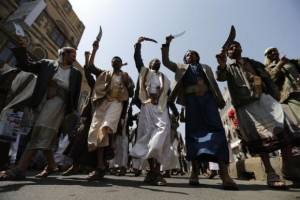 Followers of the Shi'ite Houthi group wave their traditional daggers during a demonstration in Sanaa