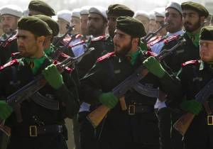 Members of Iran's Revolutionary Guards march during a parade to commemorate anniversary of Iran-Iraq war, in Tehran