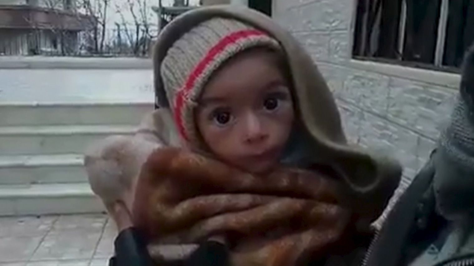 a-toddler-is-held-up-to-the-camera-in-this-still-image-taken-from-video-said-to-be-shot-in-madaya_5495944