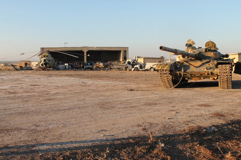 A picture taken on August 10, 2013, shows military equipment at Minnigh air base in the northern Syrian province of Aleppo. Kurdish forces backed by Arab rebel groups captured a strategic air base and the adjacent town in northern Syria from rival anti-government factions overnight on February 11, 2016, the Syrian Observatory for Human Rights said. / AFP / Zein Al-Rifai