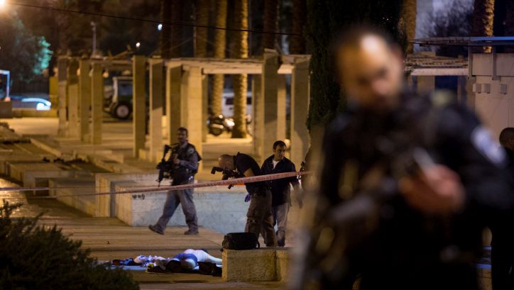 Israeli security forces near the body of a Palestinian attacker at the scene of an attempted shooting attack near Damascus Gate in Jerusalem on February 14, 2016. Two Palestinian attackers were shot and killed by Israeli security forces on Sunday night after they opened fire against police, there were no injuries from the shooting. Photo by Yonatan Sindel/Flash90 *** Local Caption *** ????? ???? ????? ??? ??? ??? ????? ??????? ??? ?????