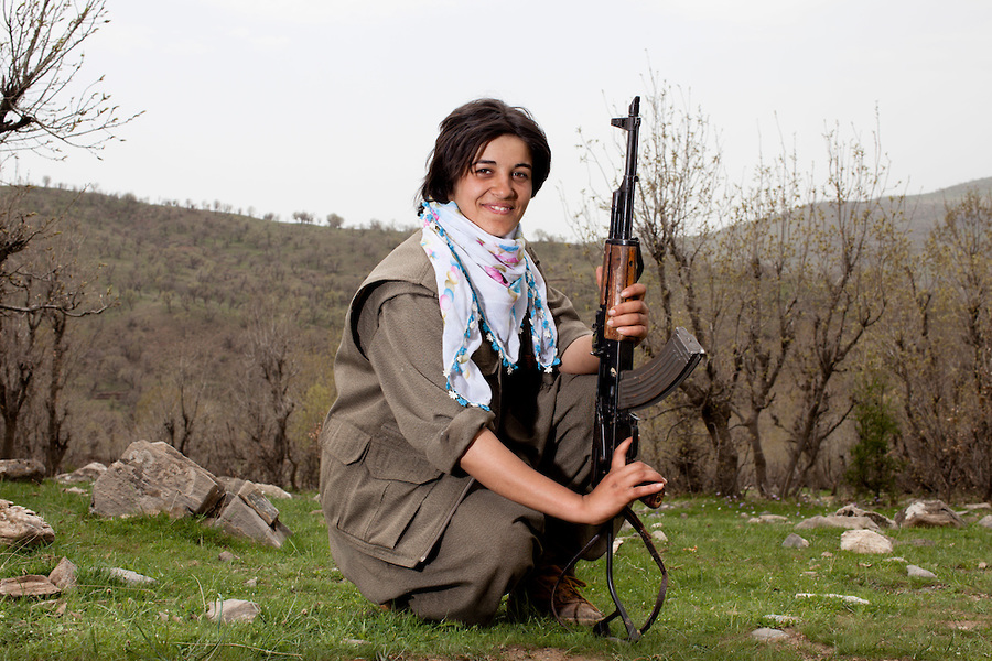 QANDIL, IRAQ: (name), a PJAK guerrilla poses for a portrait in her unit's camp situated in the mountains that make up the Iran Iraq border. The PJAK is a Kurdish separatist group fighting a guerrilla war for Kurdish independence in Iran. They were founded in 2004 when they split from the PKK, the (Kurdistan Workers' Party) which is fighting for Kurdish independence in Turkey. Both groups follow a general Communist ideology and both have male and female fighting units. Photo by Sebastian Meyer