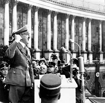 Adolf Hitler, Austrian-born dictator of Germany, proclaims to the crowds in Hofburg Square, Vienna, March 15, 1938 that Austria and Germany are one, "once and forever indivisable." (AP Photo)