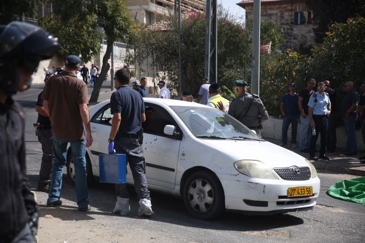 Police at a scene of a terror attack at the National Police Headquarters in Jerusalem on October 9, 2016. A Palestinian man drove by and shot civilians injuring about g people before being shot by police when he got to the Sheikh Jarah neighborhood in Jerusalem. Photo by Hadas Parush/Flash90 *** Local Caption *** ????? ??? ???????